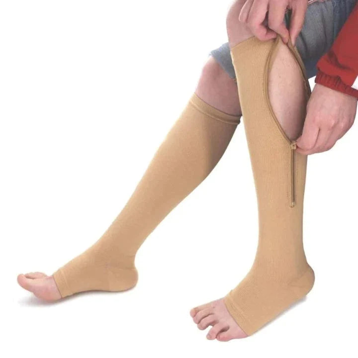 Beige Kompressionsstrümpfe mit Reißverschluss, Unisex, zur Schmerzlinderung in den Beinen.