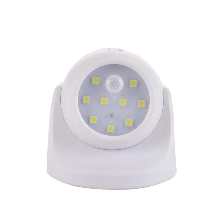 Weiße LED-Nachtlampe mit Bewegungssensor, batteriebetrieben, energiesparend, rundes Design.