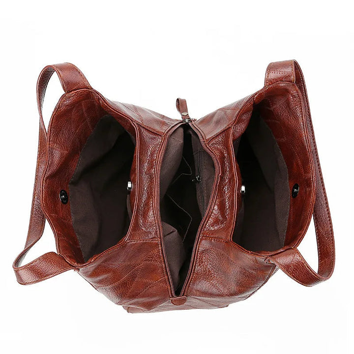 Braune Lederhandtasche mit zwei Fächern, Reißverschluss, modisch, Damenaccessoire.