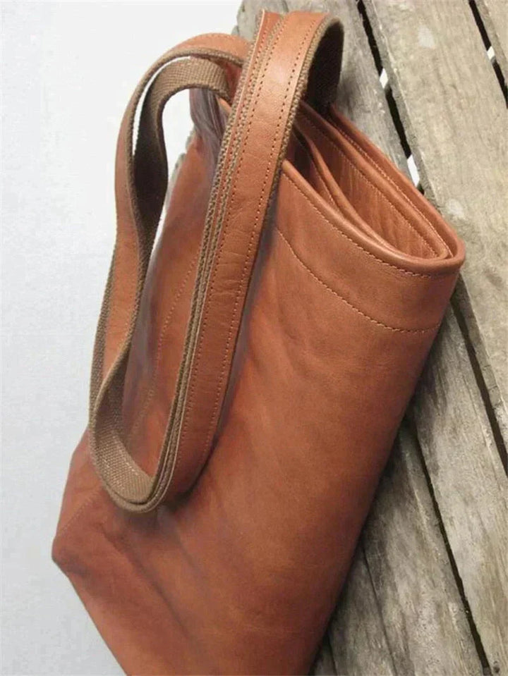 Braune Ledertasche mit robustem Griff, langlebig, elegant, Damenmode Accessoire.