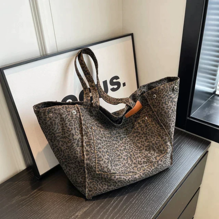 Leopardenmuster Einkaufstasche, braun, Stoff, modisch, Damenaccessoire, auf schwarzem Tisch