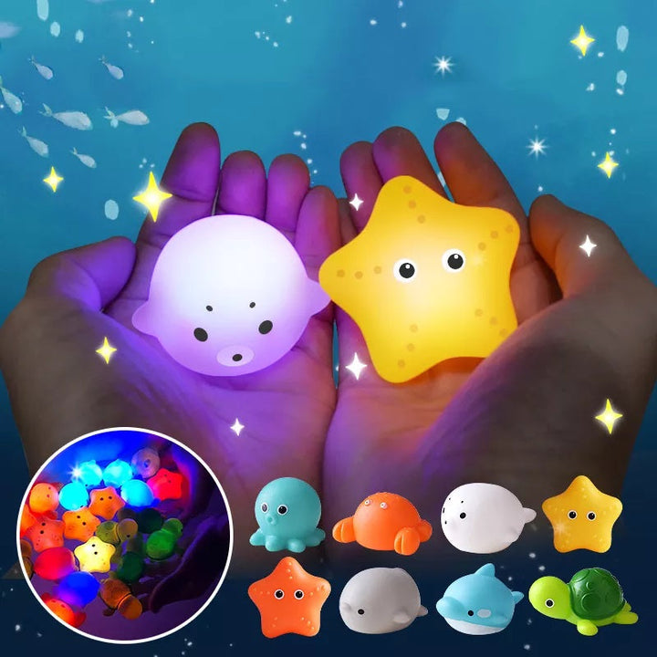 Leuchtende LED-Tierfiguren in Hand, bunte Nachtlichter für Kinder, Ozean-Thema.
