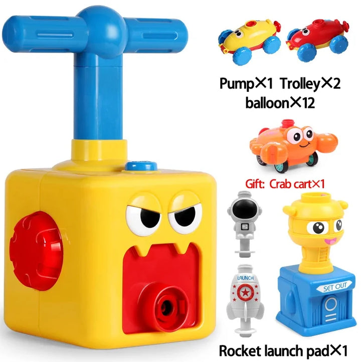 Gelbes Ballonauto-Spielzeugset mit Pumpe, Raketenabschussrampe und Krabbenwagen.