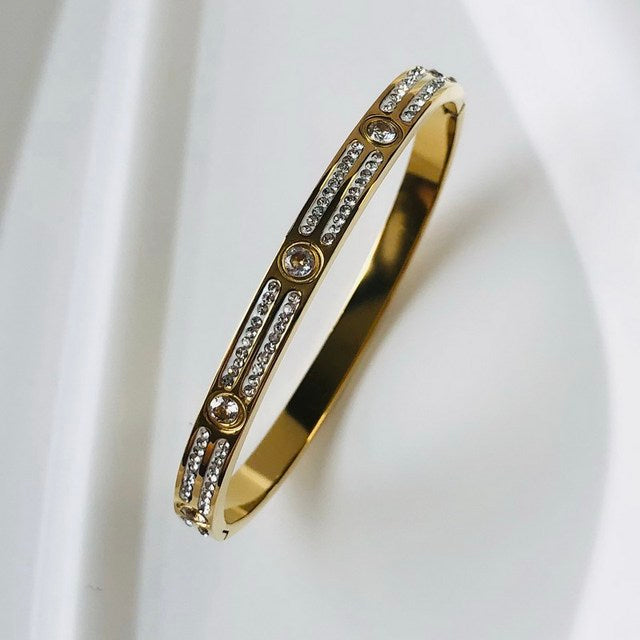 Goldenes Edelstahlarmband mit Zirkonia, wasserdicht, luxuriöses Design für Damen.