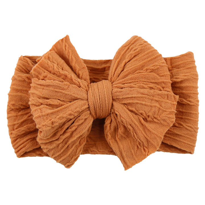 Orange Baby-Stirnband aus Baumwolle mit großer Schleife, modisches Accessoire für Kleinkinder.