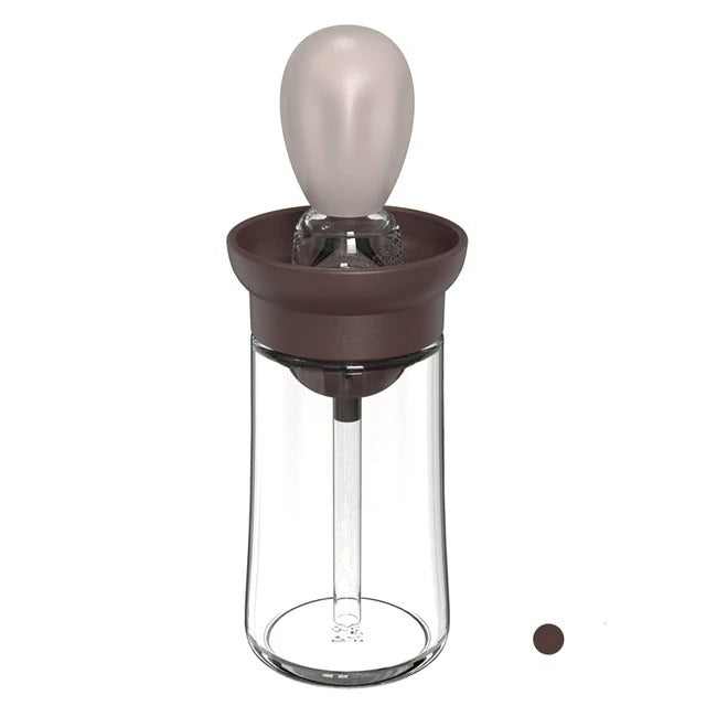 Brauner Glasflaschen-Dosierer mit Silikonaufsatz, ideal für Küche und Backen.