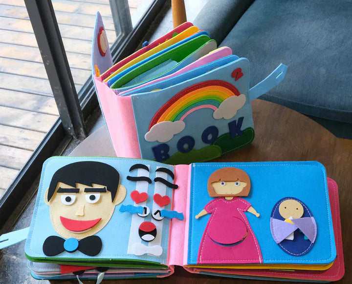 Montessori-Stoffbuch mit bunten Filzfiguren, Regenbogen, pädagogisches Spielzeug für Kinder.
