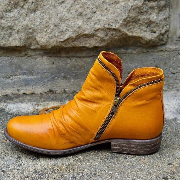 Gelbe Lederstiefeletten mit Reißverschluss, modisch, ideal für kalte Tage, Damenmode.