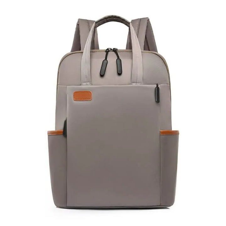 Grauer Rucksack aus Leder, stilvoll, mit mehreren Fächern, ideal für Reisen und Alltag.