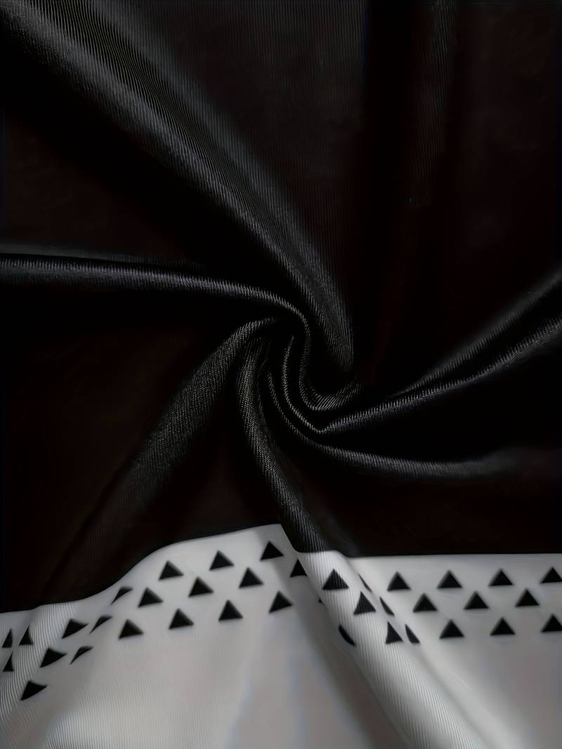 Schwarzer Stoff mit weißen Dreiecksmuster, Polyester, Textildesign, elegant, modern.