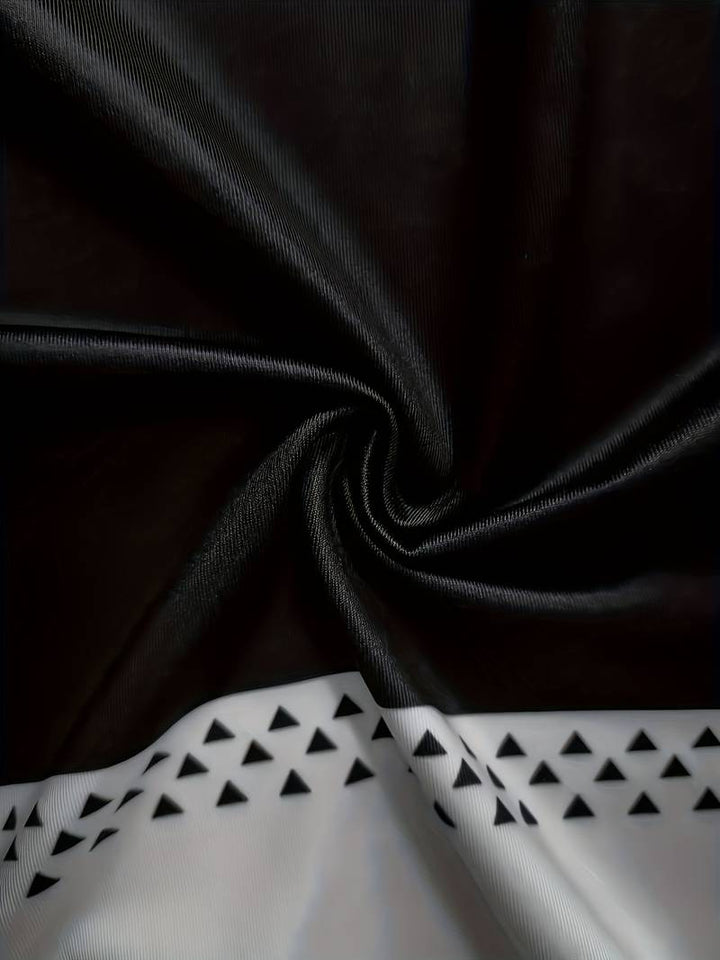 Schwarzer Stoff mit weißen Dreiecksmuster, Polyester, Textildesign, elegant, modern.