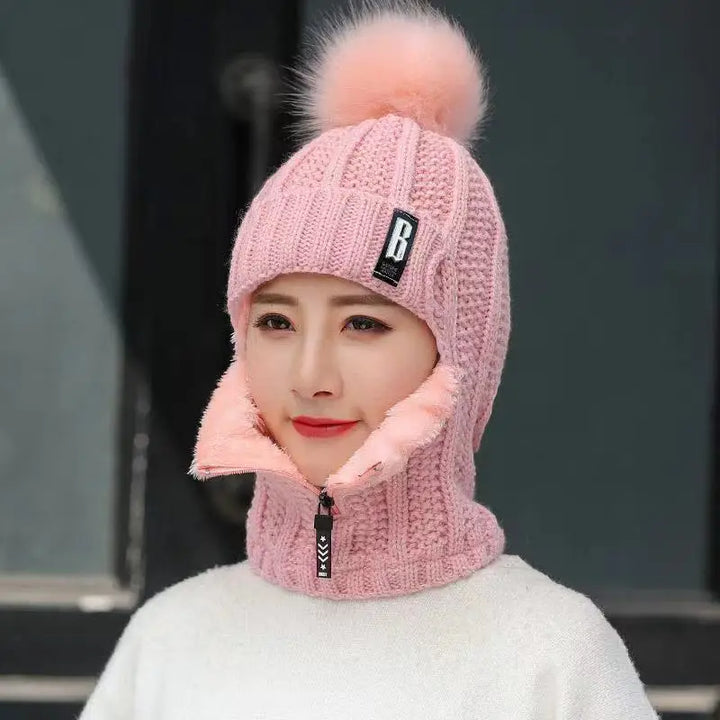 Damen Wintermütze rosa Strick mit Bommel, warm, modisch, ideal für kaltes Wetter.