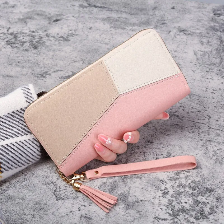 Damen-Geldbörse aus Leder in Rosa und Beige, mit Reißverschluss und Handschlaufe.