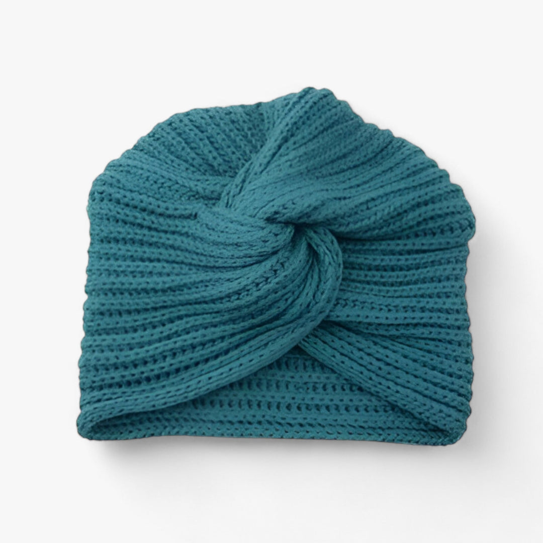 Türkise Strickmütze mit Knoten, Wintermode, Damenaccessoire, warme Kopfbedeckung, modisch.