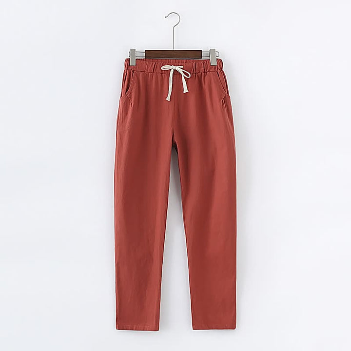 Rote Jogginghose aus Baumwolle mit Kordelzug, bequem und modisch, ideal für Freizeitkleidung.