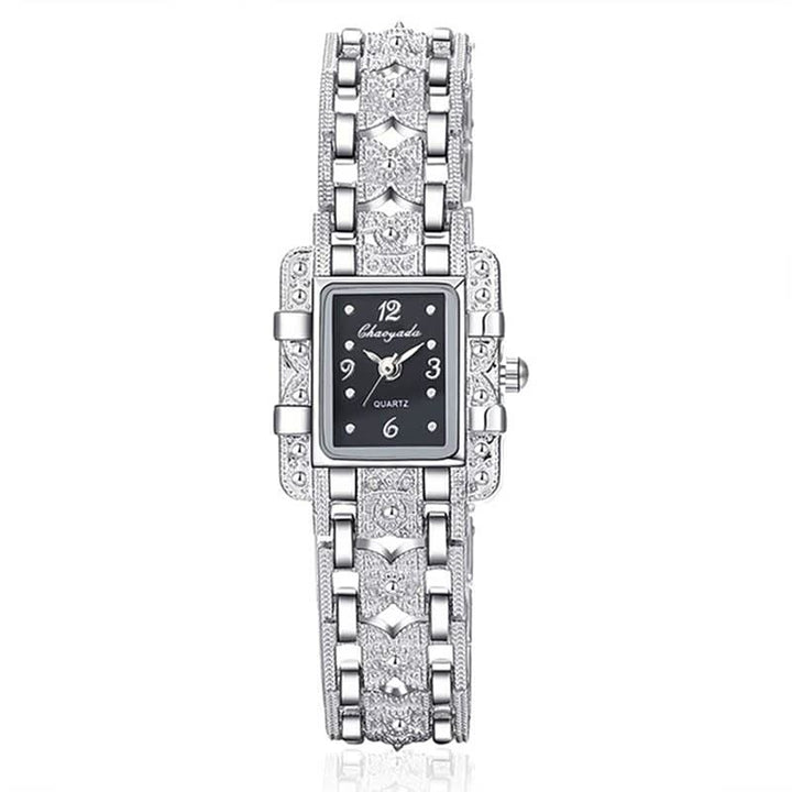 Silberne Damenarmbanduhr mit rechteckigem Zifferblatt, Strasssteinen, elegantes Design.