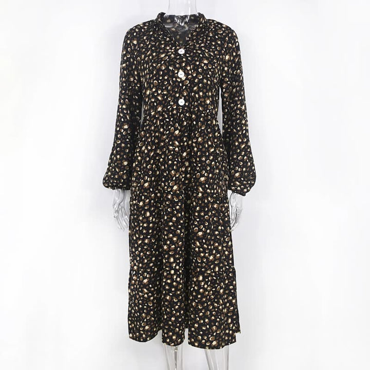 Schwarzer Damen-Jumpsuit mit weißen Punkten, lange Ärmel, Knopfleiste, modisch, elegant.