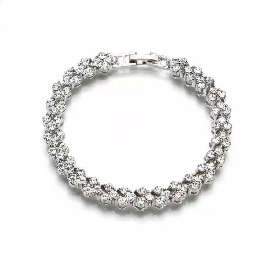 Silbernes Armband mit runden Diamanten, elegantes Schmuckstück, luxuriöses Design, Geschenkidee.