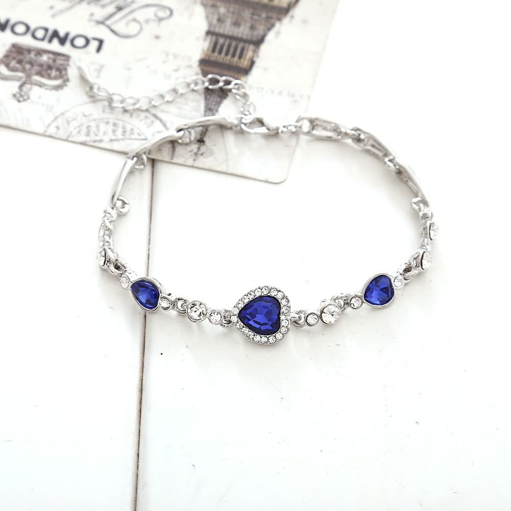 Silberarmband mit blauen Kristallen, Herzanhänger, Damen-Schmuck, elegant, modisch.