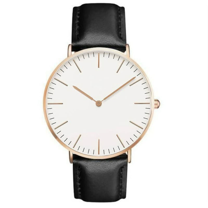 Minimalistische Armbanduhr mit schwarzem Lederarmband, weißem Zifferblatt, goldfarbenem Gehäuse.