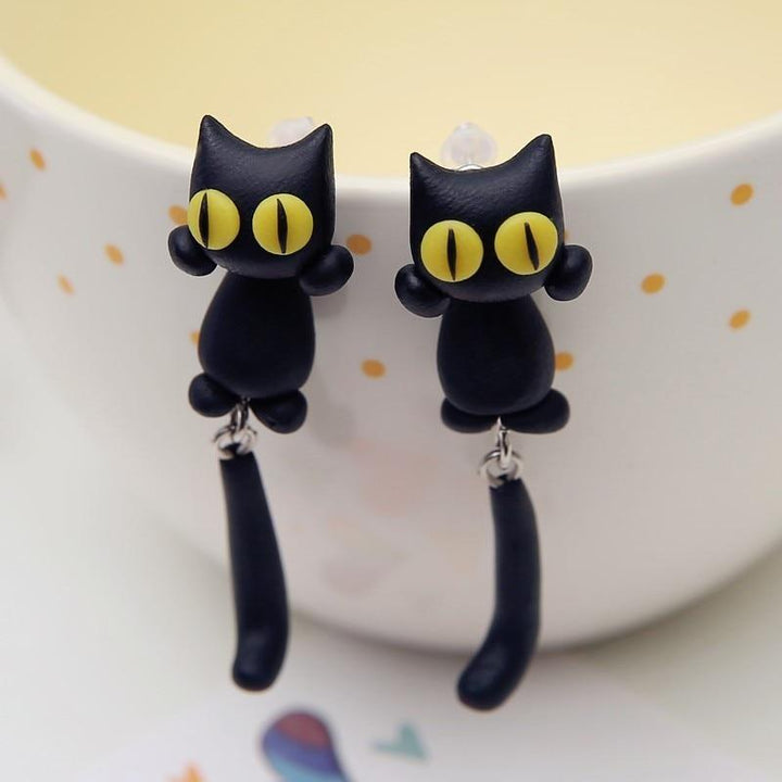 Schwarze Katzen-Ohrringe aus Polymer, gelbe Augen, handgefertigt, modisches Accessoire.