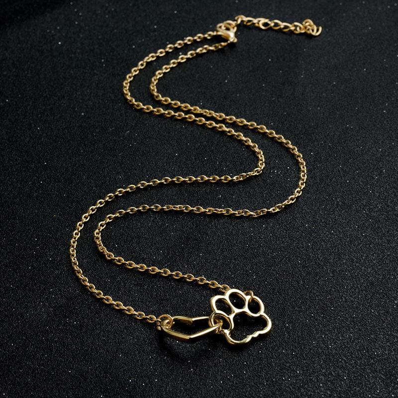 Goldene Halskette mit Pfotenanhänger, elegantes Schmuckstück, Geschenk für Tierliebhaber.
