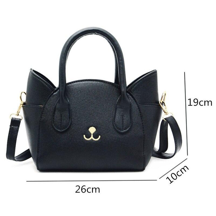 Schwarze Katzenhandtasche aus Leder mit Schulterriemen, 26x19x10 cm, modisches Accessoire.
