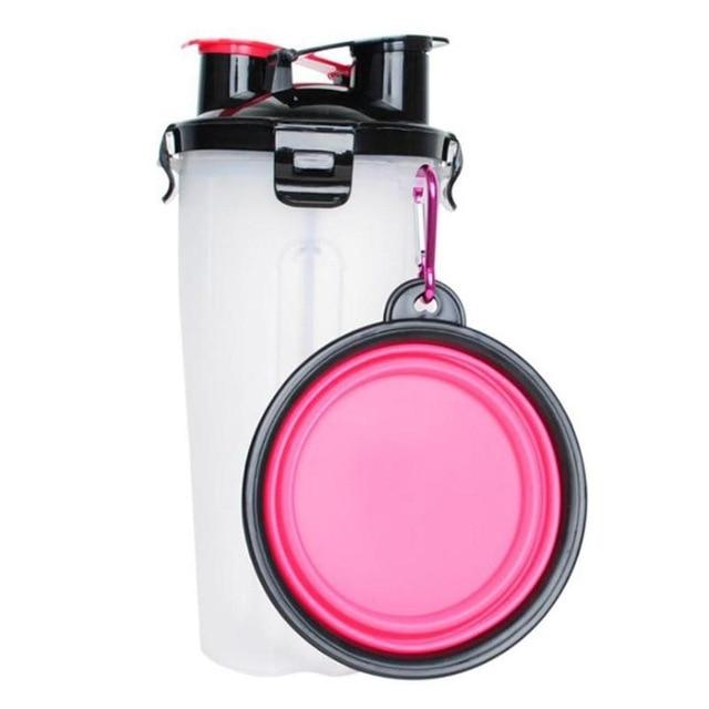 Transparente Proteinshaker-Flasche mit schwarzem Deckel und pinkem faltbarem Napf, BPA-frei.