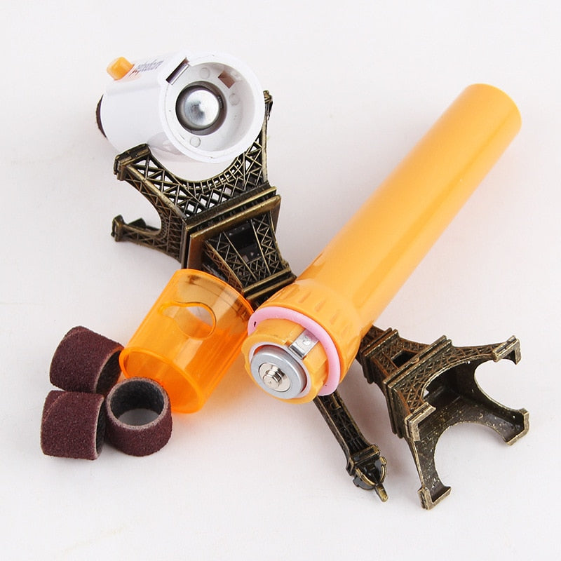 Elektrische Nagelfeile orange, tragbar, mit Aufsätzen, Eiffel-Turm-Halterung.