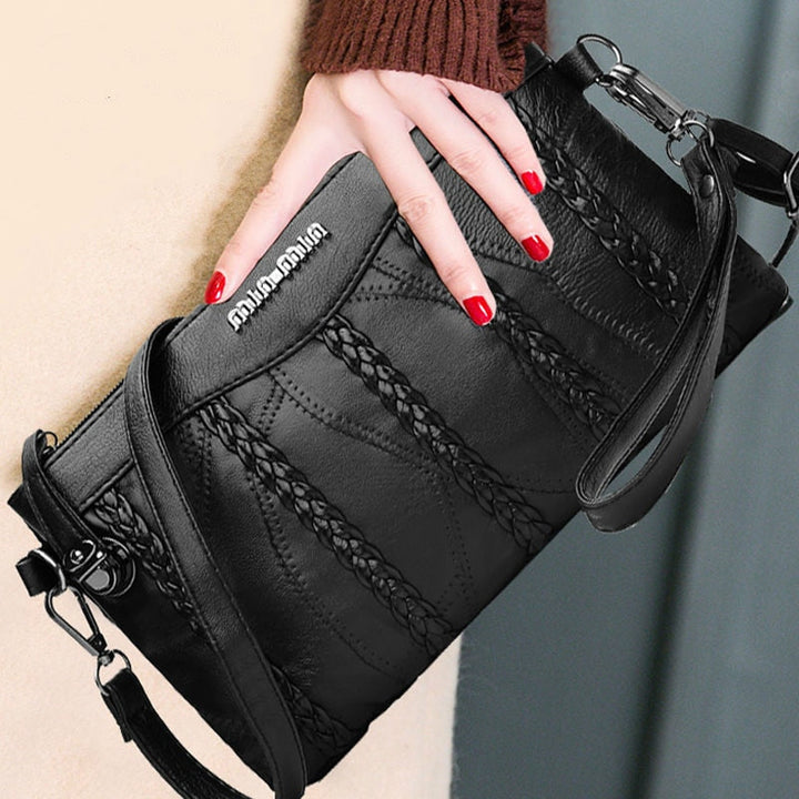 Dámská crossbody kabelka z PU kůže s prostorným vnitřkem.