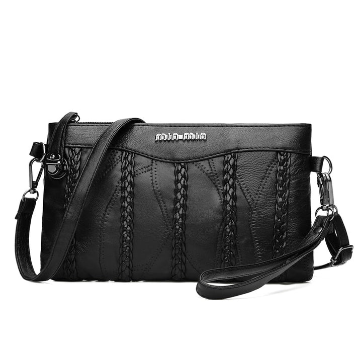 Dámská crossbody kabelka z PU kůže s prostorným vnitřkem.