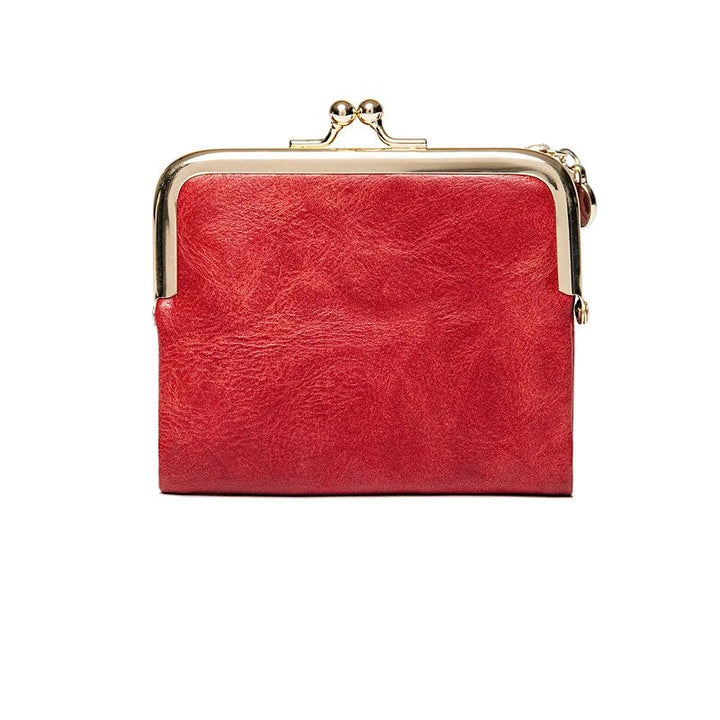 Rote Leder-Geldbörse mit Metallrahmen, Vintage-Stil, Damen-Accessoire, elegant und modisch.