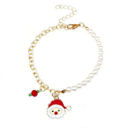 Goldenes Armband mit Perlen, Weihnachtsmann-Anhänger, festlicher Schmuck, Damenaccessoire.