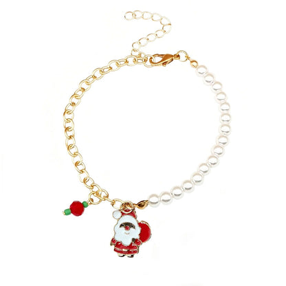 Goldenes Armband mit Weihnachtsmann-Anhänger und Perlen, festlicher Schmuck, Geschenkidee.