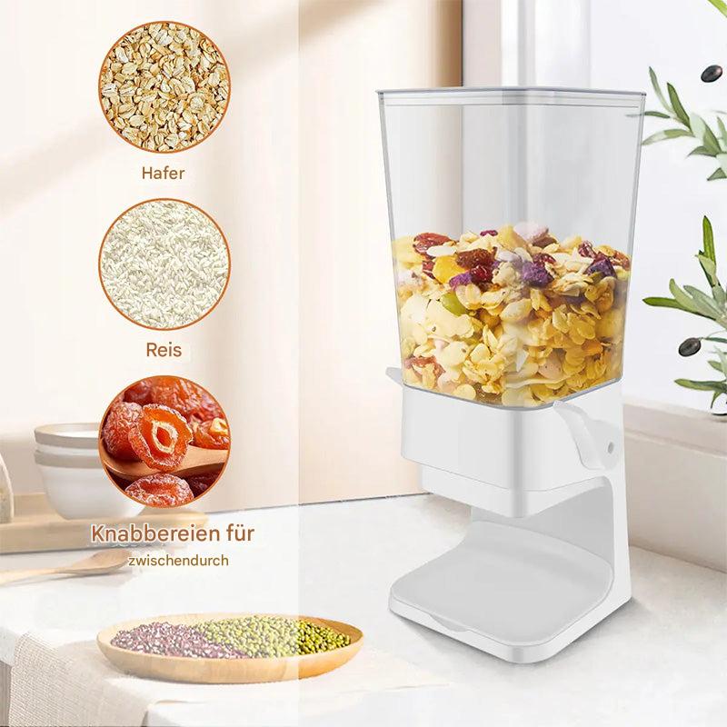 Weißer Müslispender mit transparentem Behälter, gefüllt mit Cornflakes und Trockenfrüchten.