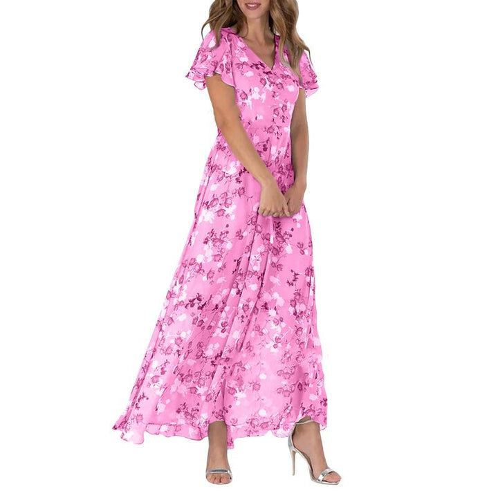 Frau in langem, rosa Blumenkleid aus Chiffon, Sommermode, elegante Abendgarderobe.