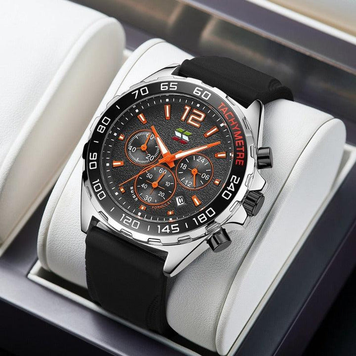 Schwarze Chronographen-Armbanduhr mit Edelstahlgehäuse und orangefarbenen Akzenten auf Kissen.