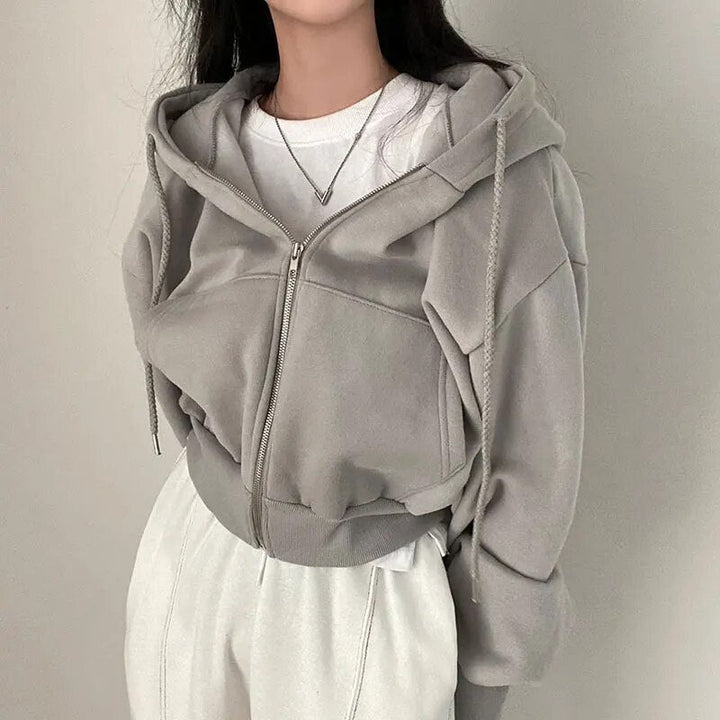 Dámská vesta krátkého střihu s kapucí a oversized střihem – Rinette