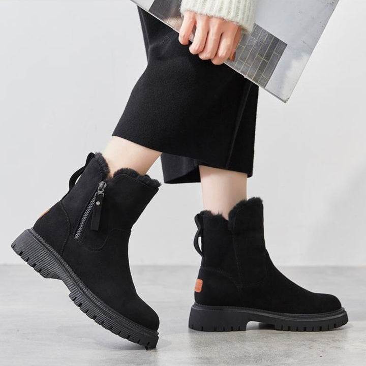 Schwarze Damen-Winterstiefel, warm gefüttert, mit Reißverschluss, rutschfeste Sohle.