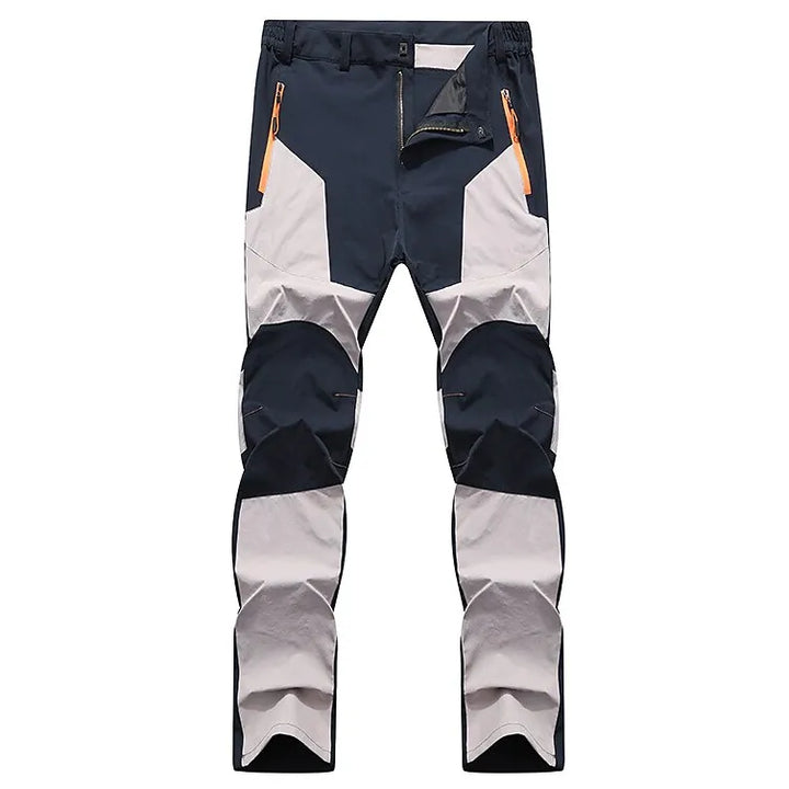 Wasserdichte Outdoor-Hose, schwarz-grau, mit Reißverschlusstaschen, ideal für Wandern und Trekking.